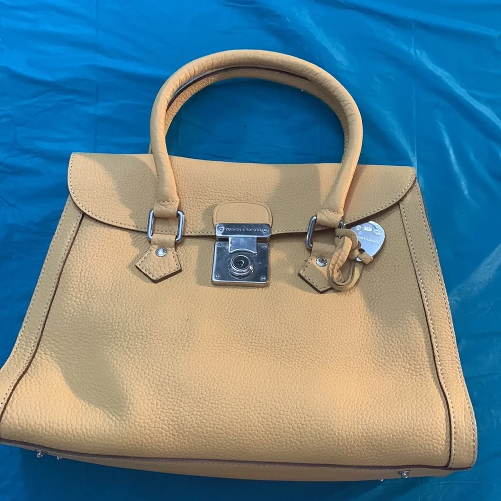 Almost New Dooney and Bourke Satchel with matching wallet. Rich Mustard Color
